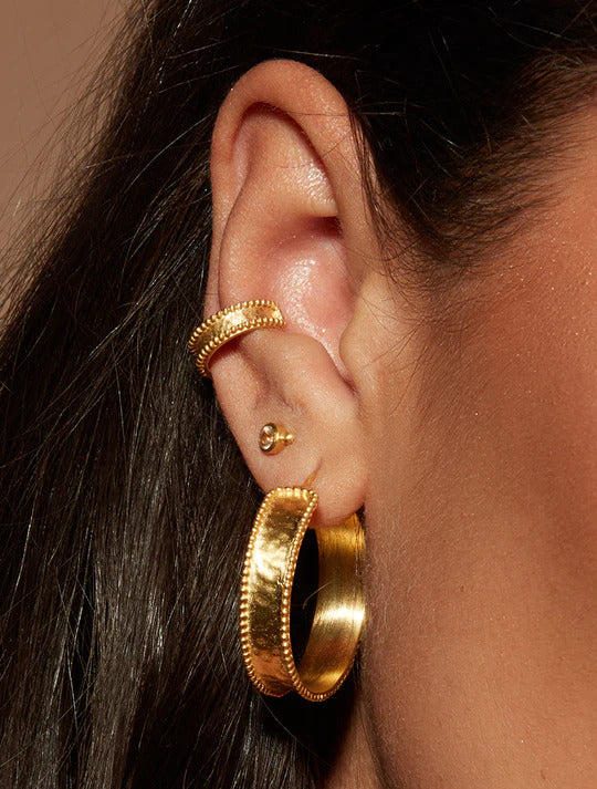 Stylish and versatile earrings collection featuring a range of designs, including studs, hoops, dangles, and statement pieces.